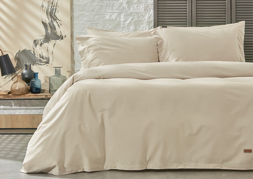 Plain duvet cover set in beige color displayed in bedroom